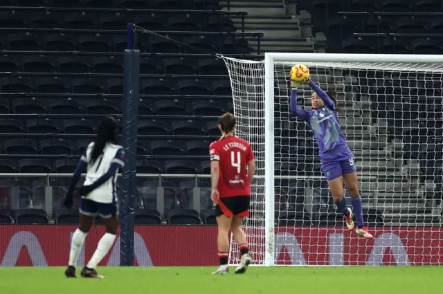 Phallon Tullis-Joyce saves a shot from Jessica Naz
