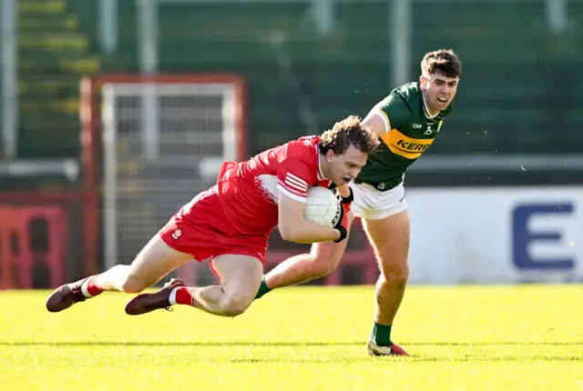 Donncha Gilmore of Derry is tackled by Dylan Geaney of Kerry