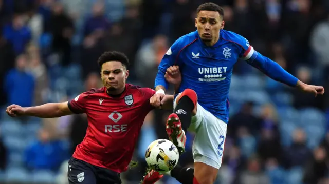 Ross County's George Robesten with Rangers' James Tavernier