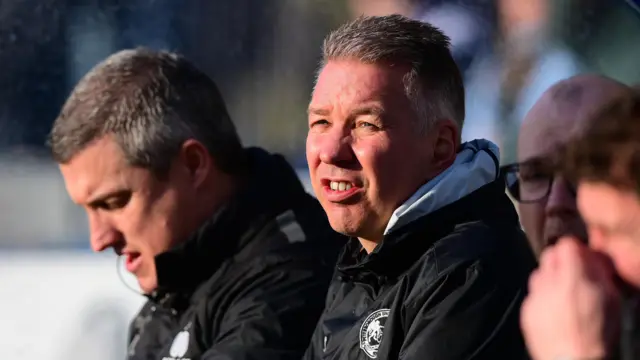 Darren Ferguson sat in the dugout