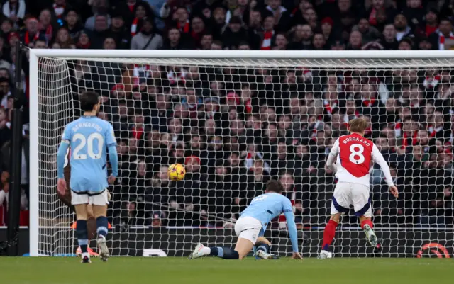 Arsenal's Martin Odegaard scores their first goal