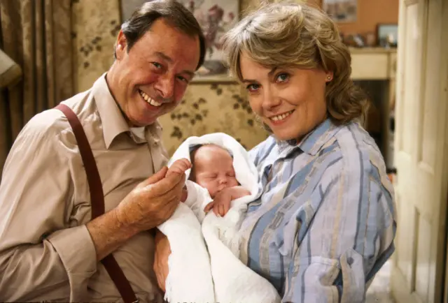 arthur and pauline fowler hold baby martin