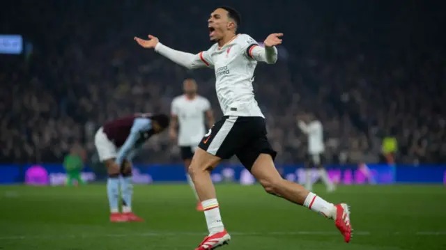 Trent Alexander-Arnold celebrates scoring an equaliser for Liverpool at Aston Villa