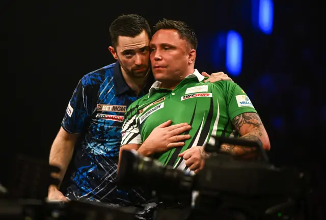 Luke Humphries embraces Gerwyn Price