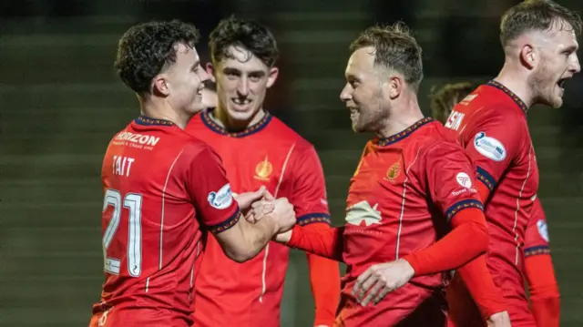 Falkirk's Scott Arfield celebrates with Dylan Tait after scoring to make it 1-0 during a William Hill Championship match between Greenock Morton and Falkirk at Cappielow Park, on February 21, 2025, in Greenock, Scotland. (Photo by Mark Scates / SNS Group)