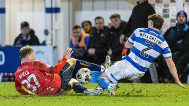 Falkirk's Scott Arfield (L) and Greenock Morton's Cammy Ballantyne (R) in action during a William Hill Championship match between Greenock Morton and Falkirk at Cappielow Park, on February 21, 2025, in Greenock, Scotland. (Photo by Mark Scates / SNS Group)