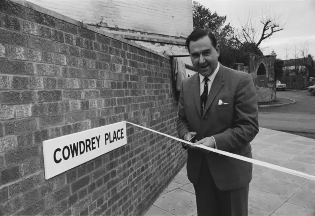 Colin Cowdrey cuts the ribbon on a street named after him