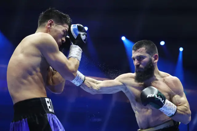 Artur Beterbiev throws a punch at Dmitry Bivol