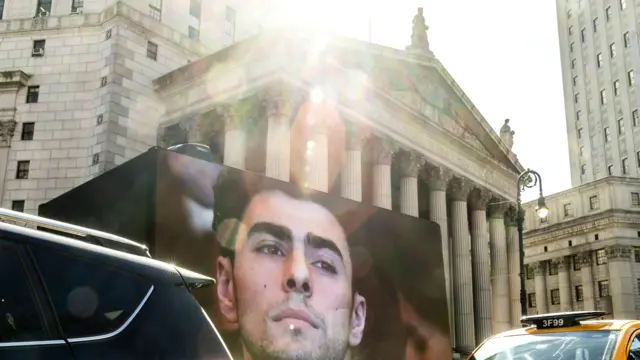 Trucks with Mangione's face on pictured outside courthouse