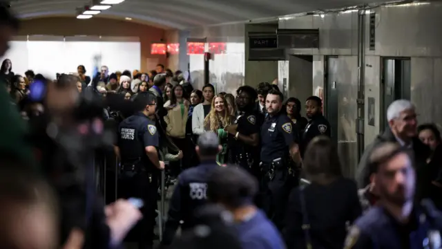 Supporters of Luigi Mangione, the suspect in the killing of UnitedHealth Group chief executive Brian Thompson, gather at a corridor, on the day Mangione is expected to attend a hearing in Manhattan Criminal Court on New York state murder and terrorism charges