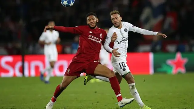 Neymar of Paris Saint-Germain vies with Joe Gomez