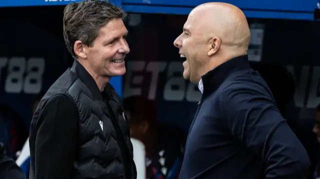 Liverpool's manager Arne Slot (right) is greeted by Crystal Palace's manager Oliver Glasner