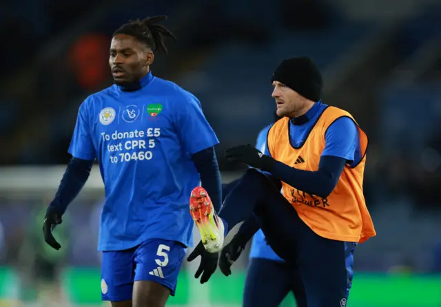 Leicester City's Jamie Vardy and Caleb Okoli during the warm up before the match A