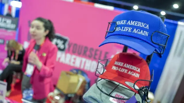 Hats in a stack with the words: "Make America pro-life again" written on the front