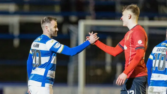 Greenock Morton's Niall McGinn (L) and Falkirk's Luke Graham (R) shake hands at full time during a William Hill Championship match between Greenock Morton and Falkirk at Cappielow Park, on February 21, 2025, in Greenock, Scotland. (Photo by Mark Scates / SNS Group)