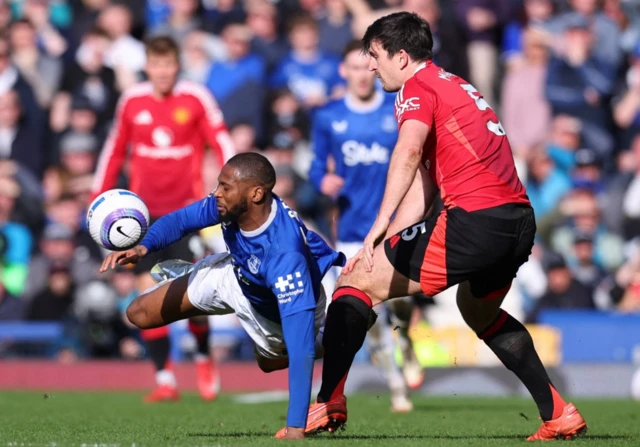 Everton's Beto in action with Manchester United's Harry Maguire