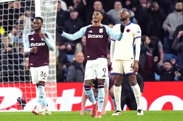 Rashford cheers and shakes his fists in celebration at full time