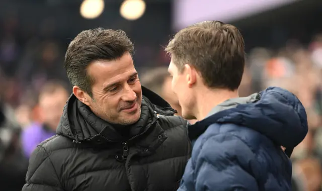 Marco Silva, Manager of Fulham, interacts with Oliver Glasner