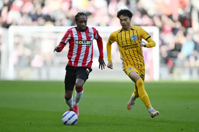 Kyle Walker-Peters of Southampton is put under pressure by Kaoru Mitoma