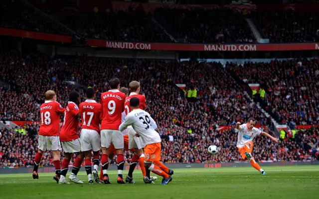 Charlie Adam of Blackpool scores against Man Utd for Blackpool