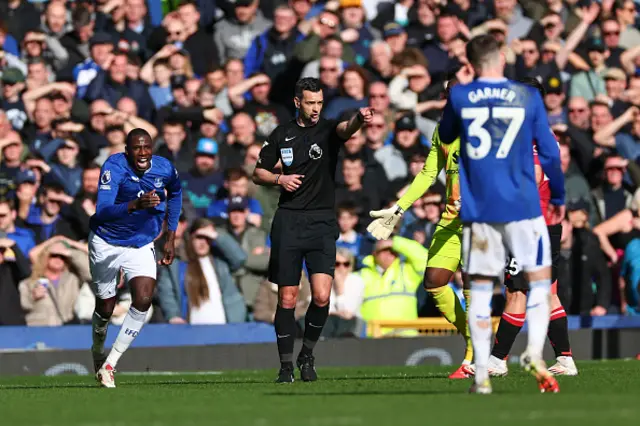 Referee Andy Madley awards Beto of Everton goal