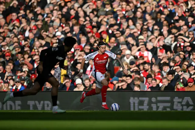 Riccardo Calafiori runs with the ball