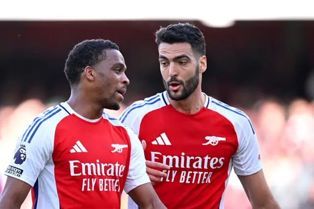 Mikel Merino of Arsenal speaks to teammate Jurrien Timber