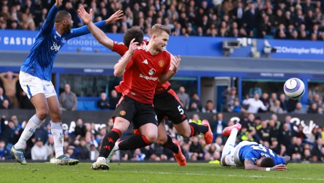 Everton's Ashley Young reacts after sustaining an injury as Manchester United's Matthijs de Ligt