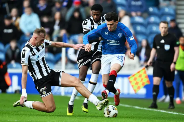 angers Ianis Hagi is tackled by St Mirren's Killian Phillips during a William Hill Premiership match between Rangers and St Mirren at Ibrox Stadium, on February 22, 2025, in Glasgow, Scotland.  (Photo by Rob Casey / SNS Group)