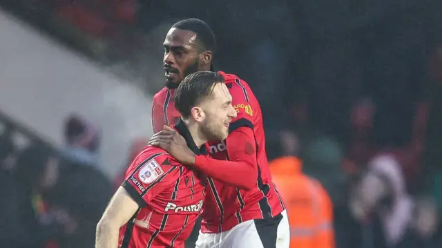 Walsall's Charlie Larkin and Levi Amantchi celebrate Amantchi's goal against Chesterfield