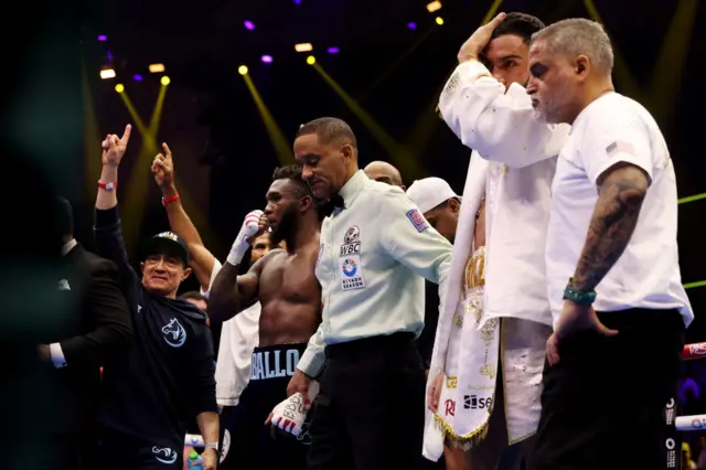 Carlos Adames looks worried as the scorecards are read out