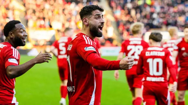 Oday Dabbagh celebrates scoring for Aberdeen.