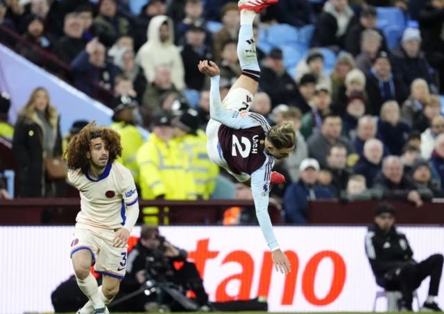 Aston Villa's Matty Cash hits the floor