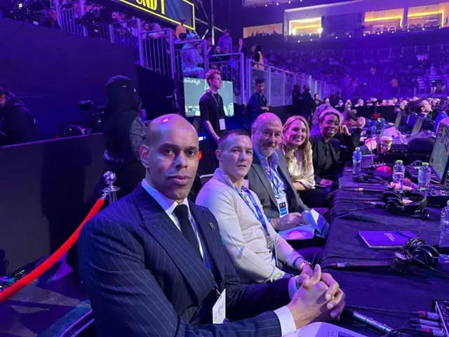 Picture of 5 live team at ringisde, from left to right, Ronald McIntosh, Josh Warrington, Steve Bunce, Stacey Copeland and Jeanette Kwakye.