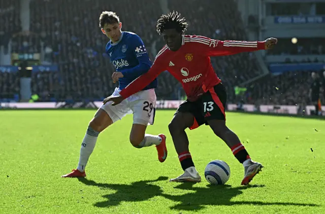 Jesper Lindstrom (L) vies with Manchester United's Danish defender Patrick Dorgu