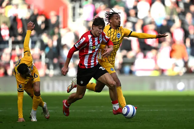 Tyler Dibling of Southampton battles for possession with Yasin Ayari and Joao Pedro