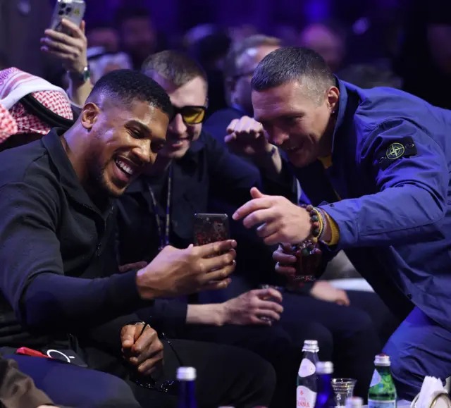 Anthony Joshua and Oleksandr Usyk take a selfie at ringside