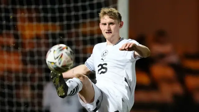 Port Vale's Nathan Smith kicking the ball during their match against Notts County