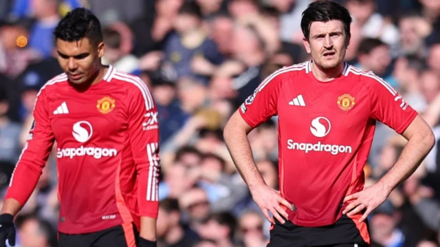 Manchester United's Harry Maguire and Casemiro look dejected after Everton's Abdoulaye Doucoure scores