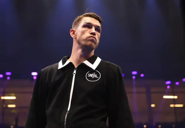 Callum Smith wearing a black zip up jacket