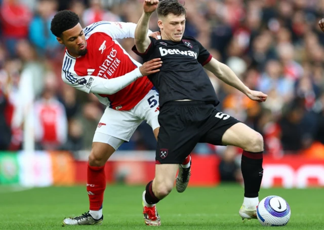 Arsenal's Ethan Nwaneri in action with West Ham United's Oliver Scarles