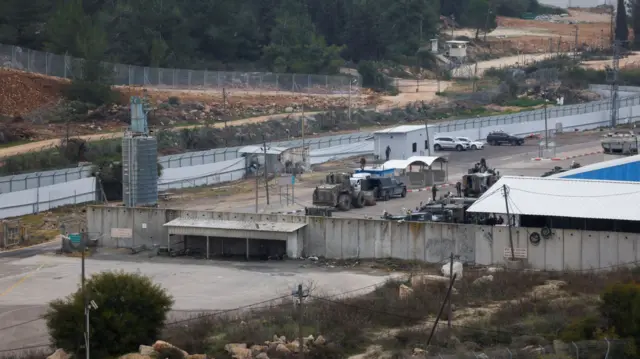 An aerial photo of Ofer Prison. It shows military vehicles, walls, and high fences.