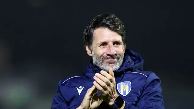 Colchester boss Danny Cowley applauding