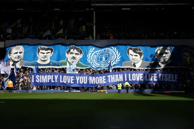 Everton fans hold up a tifo reading "i simply love you more than i love life itself"