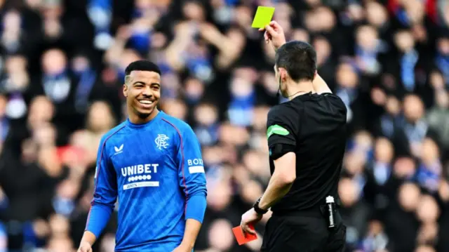 Referee Kevin Clancy downgrades a red card to yellow for Rangers Hamza Igamane during a William Hill Premiership match between Rangers and St Mirren at Ibrox Stadium, on February 22, 2025, in Glasgow, Scotland.  (Photo by Rob Casey / SNS Group)