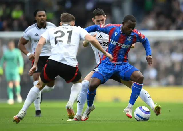 Tyrick Mitchell of Crystal Palace is challenged by Sasa Lukic and Timothy Castagne