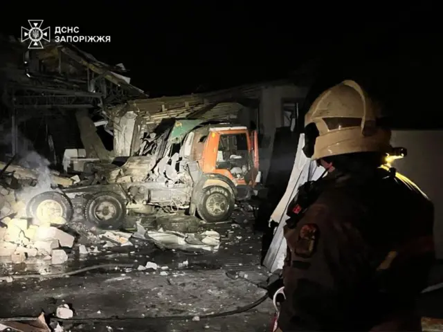 Collapsed buildings and crushed trucks met emergency workers at the scene in Zaporizhzhia