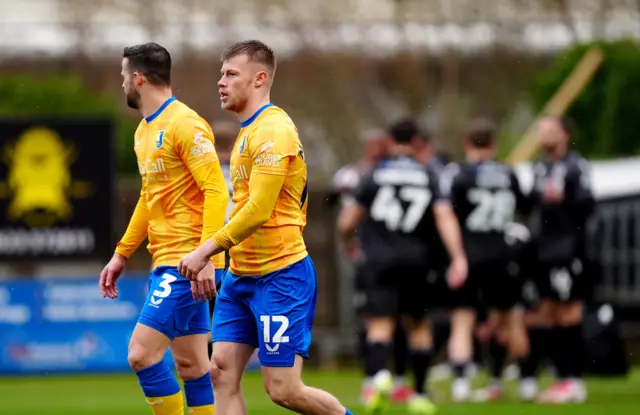 Mansfield's Calum Macdonald after scoring an own goal against Wrexham