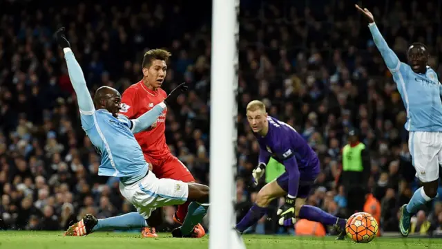 Roberto Firmino scores for Liverpool against Man City