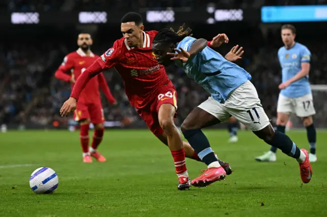 Trent Alexander-Arnold and Jeremy Doku